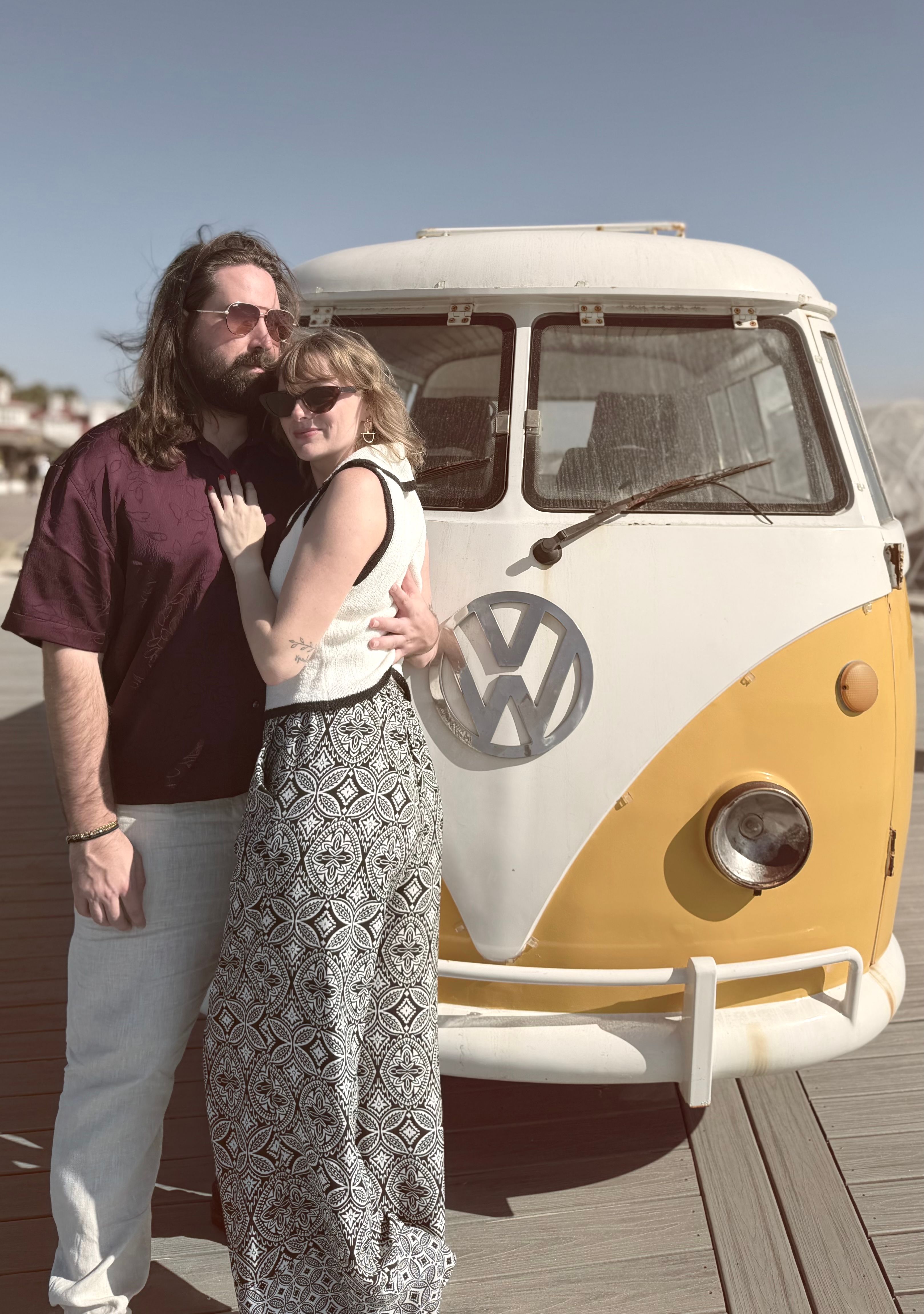 Chris and Paige in front of a vintage VW bus