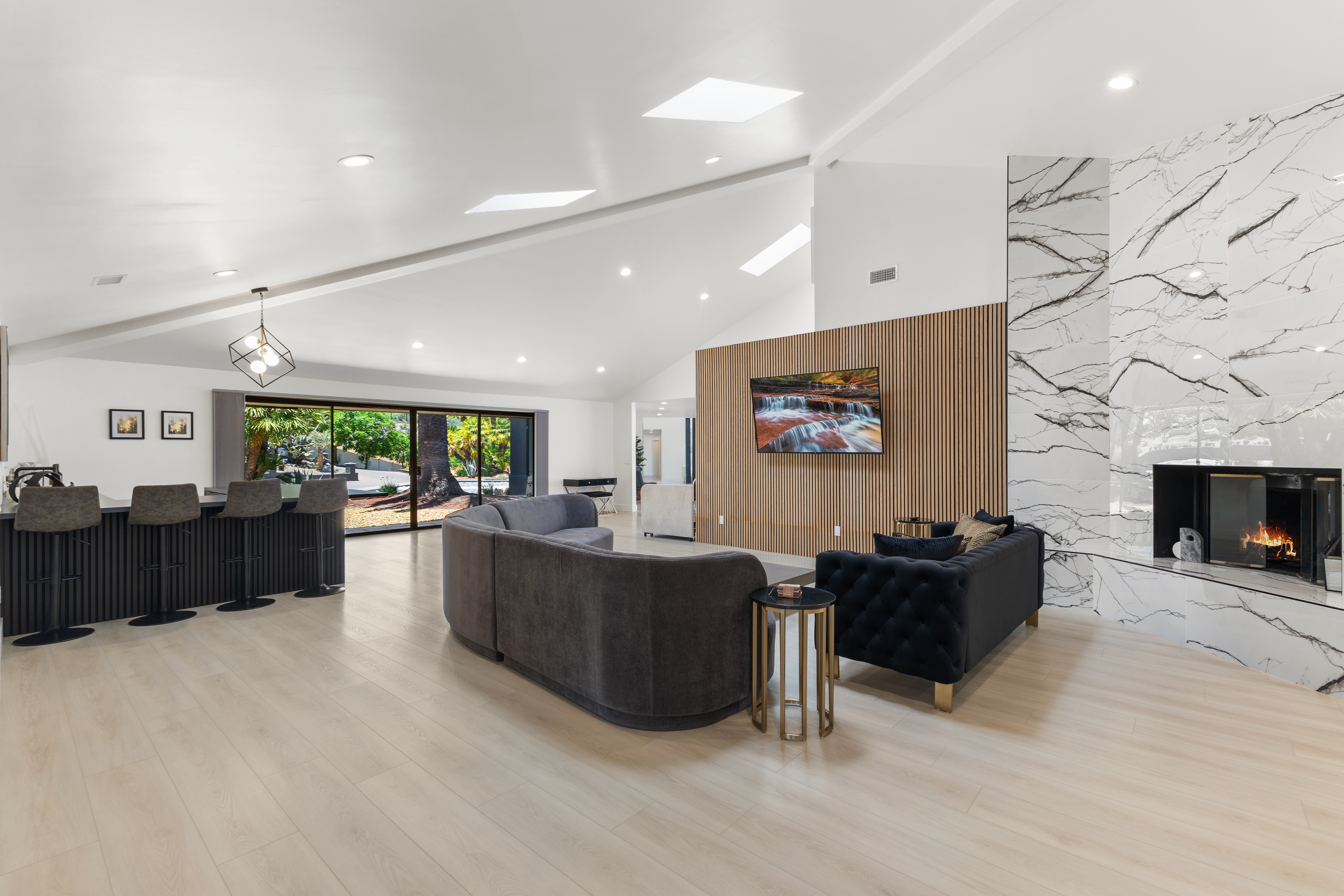 Modern interior living room with marble fireplace and wood accents